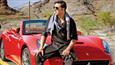 Akshay invites you for a Long Drive in his Red Ferrari!