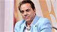 What makes Dharmendra feel shy?