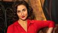 Elli AvrRam looks ravishing in the red suit as she plays with this cutie