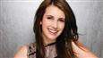 Emma Roberts goes brunette