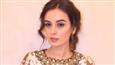 Evelyn Sharma looks regally elegant in a fawn, textured, princess line drape!