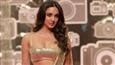 Kiara Advani looks like a golden idol in a golden saree!