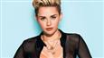 Miley Cyrus flashes skin in bizarre outfit