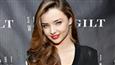 Miranda Kerr poses topless