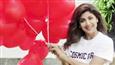 What is Shilpa Shetty Kundra hiding behind 100 balloons?