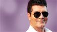 Simon Cowell teaches bad habits to son