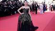 Nitanshi Goel Stuns the World at Cannes Film Festival 2025 in a Custom Black and Gold Gown!