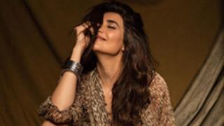Karishma Tanna looks ravishing in a flowy leopard print sheath dress!