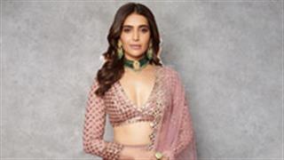 Karishma Tanna looks festive and all set for a blasting Diwali in a pastel pink lehenga!