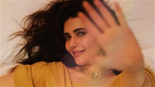 Karishma Tanna looks classy and fun in a cute yellow Alison Flutter dress!