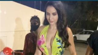 Nora Fatehi looks feminine and glamourous in a pastel yellow floral gown asymmetrical ruffle dress!