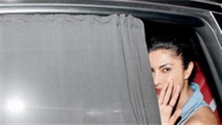 Why was Priyanka  hiding behind blinds?