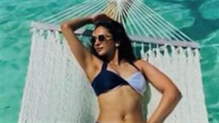 Rakulpreet Singh ravishingly chill on the hammock by the beach!