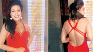 Rituparna stands out in a backless red dress