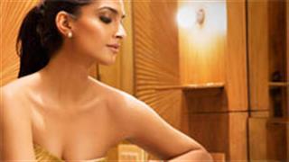 Sonam unveils Vikas Khanna's book at Cannes
