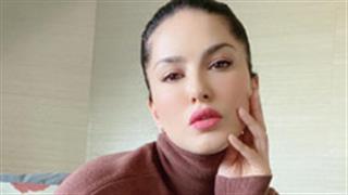 Sunny Leone gives major winter fashion goals by making a statement in knits and pants!