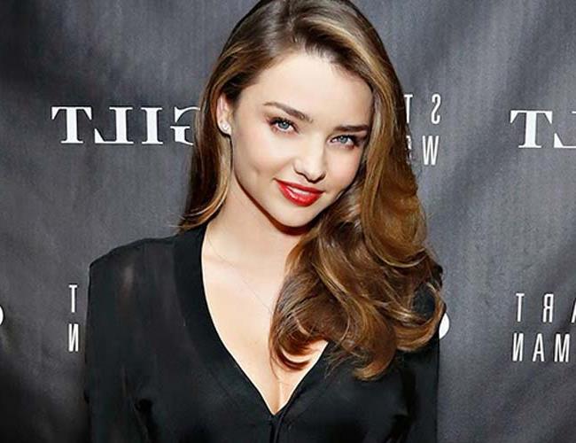 Miranda Kerr poses topless