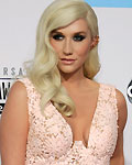 Hip hop artist Ke$ha arrives st the 40th American Music Awards in Los Angeles