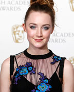 Saoirse Ronan poses for photographers at the British Academy of Film and Arts (BAFTA) awards ceremony at the Royal Opera House in London