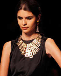 A model presents a creation by Colombian designer Andres Otalora during the Cali Exposhow in Cali