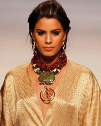 A model presents a creation by Colombian designer Andres Otalora during the Cali Exposhow in Cali