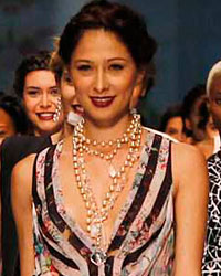 Models present creations by designer Nicole Miller during Cali Exposhow