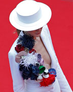 Model and designer Olga Sorokina poses on the red carpet as she arrives for the screening of the film 'Inside Llewyn Davis' in competition during the 66th Cannes Film Festival