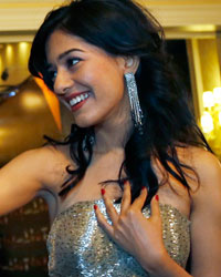 Amrita Rao shakes hands with her fans on the green carpet before the 14th annual International Indian Film Academy (IIFA) awards show in Macau