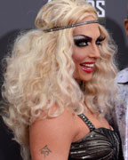 RuPaul and guest arrive at the 2013 MTV Movie Awards in Culver City, California