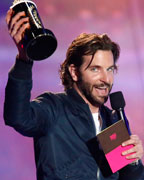 Actor Bradley Cooper accepts the award for best kiss that he shares with actress Jennifer Lawrence for 'Silver Linings Playbook' at the 2013 MTV Movie Awards in Culver City, California