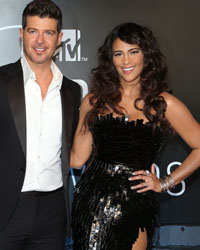 Robin Thicke and wife actress Paula Patton arrive at the 2013 MTV Video Music Awards in New York