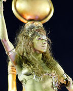 A reveller of the Salgueiro samba school participates on the first night of the annual carnival parade in Rio de Janeiro's Sambadrome