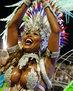 A reveller from the Inocentes de Belford Roxo samba school participates during the first night of the annual carnival parade in Rio de Janeiro's Sambadrome