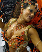 Drum Queen Lucilene Caetano of the Inocentes de Belford Roxo samba school dances on the first night of the annual carnival parade in Rio de Janeiro's Sambadrome