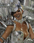 A reveller from Grande Rio samba school participates during the annual Carnival parade in Rio de Janeiro's Sambadrome