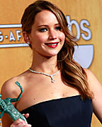 Jennifer Lawrence poses backstage with her award for outstanding female actor in a leading role for Silver Linings Playbook at the 19th annual Screen Actors Guild Awards