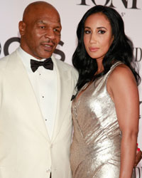 Former heavyweight boxing champion Mike Tyson and his guest arrive to the American Theatre Wing's annual Tony Awards in New York
