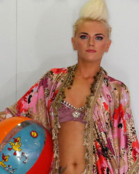 Models present creations from the Leigh Taylor Designs collection during Liverpool Fashion Week in northern England