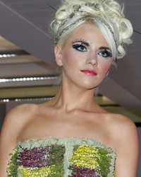 A model presents a creation made entirely of plants from the Florina collection during Liverpool Fashion Week in northern England