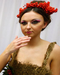 Models, wearing clothing made entirely from plants, wait backstage before the presentation of the Florina collection during Liverpool Fashion Week in northern England