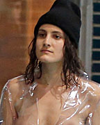 Models present creations by French designer Simon Porte Jacquemus as part of his Fall-Winter 2013-2014 women's ready-to-wear fashion show during Paris Fashion Week