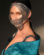 A model presents a creation from Lino Villaventura's 2013-2014 summer collection during Sao Paulo Fashion Week