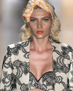 A model presents a creation from the Forum 2013-2014 summer collection during Sao Paulo Fashion Week