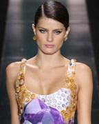 Brazilian model Isabeli Fontana presents a creation from the Agua de Coco 2013-2014 summer collection during Sao Paulo Fashion Week
