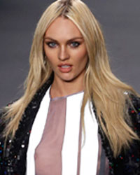 South African model Candice Swanepoel presents a creation from the Forum 2014 winter collection during Sao Paulo Fashion Week