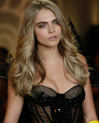 Model Cara Delevingne presents a creation during the annual Victoria's Secret Fashion Show in New York