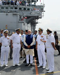 Narendra Modi at Narendra Modi steps on board INS Vikramaditya