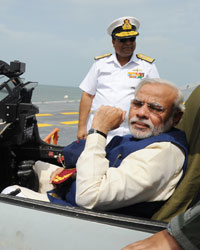 Narendra Modi at Narendra Modi steps on board INS Vikramaditya