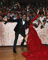 Ranveer Singh and Deepika Padukone with media photographers