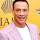 Belgian actor Van Damme arrives for a news conference in Dubai